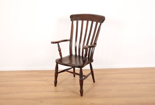 AN ELM AND BEECH HIGH BACKED WINDSOR CHAIR