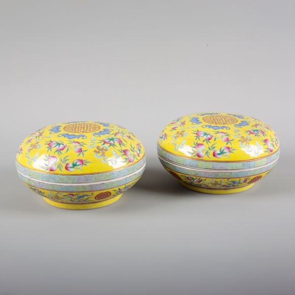 A PAIR OF YELLOW GLAZED FAMILLE ROSE BOWLS AND COVERS