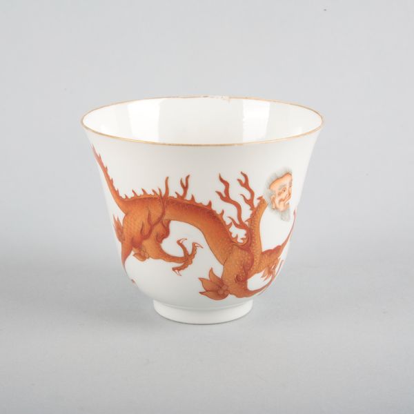 AN UNUSUAL CHINESE PORCELAIN IRON RED 'DRAGON' BOWL
