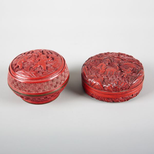 TWO SIMILAR CHINESE CINNABAR LACQUER BOXES AND COVERS