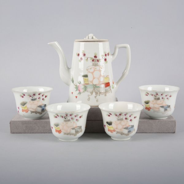 A CHINESE PORCELAIN FAMILLE ROSE TEA SERVICE