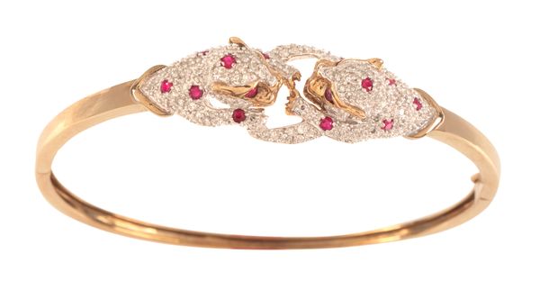 A DIAMOND AND RUBY PANTHER BANGLE
