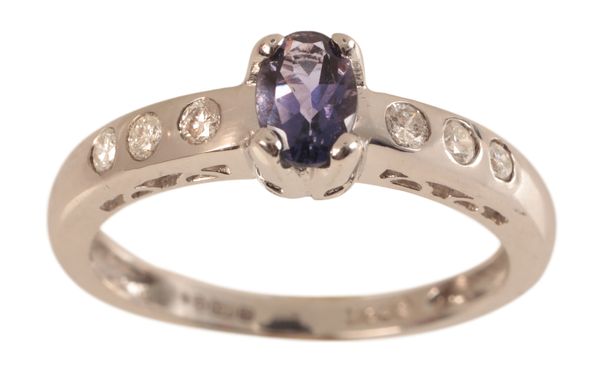 A TANZANITE AND DIAMOND RING