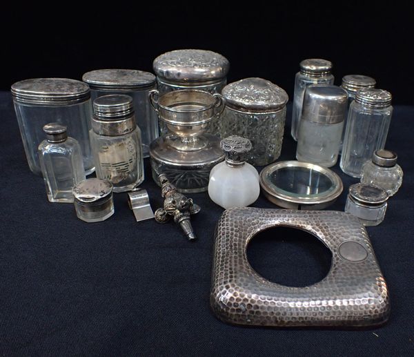 A COLLECTION OF SILVER MOUNTED GLASS DRESSING TABLE BOTTLES