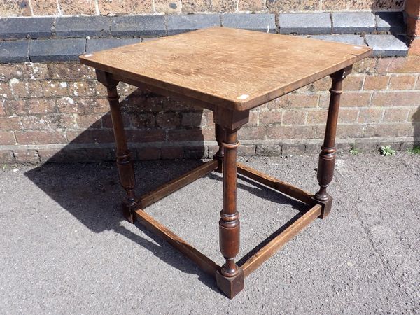 AN OAK TOPPED TABLE WITH OLDER  WALNUT LEGS