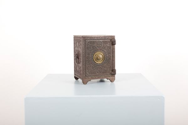 A NOVELTY MINIATURE CAST IRON SAFE JEWELLERY BOX
