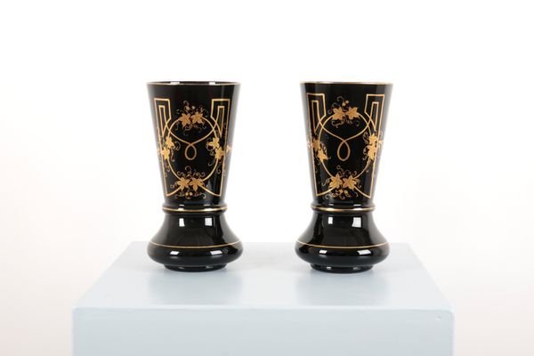 A PAIR OF AMETHYST FLARED NECK GLASS VASES