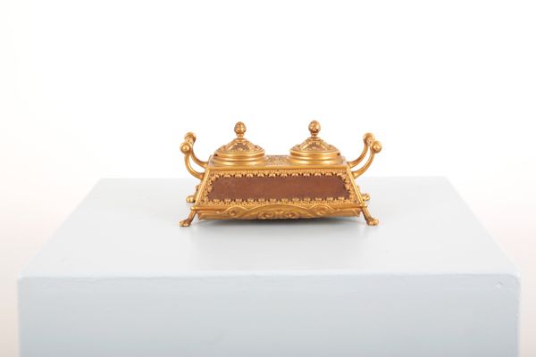 A FRENCH DESK STAND IN GILT-METAL WITH LEATHER MOUNTS