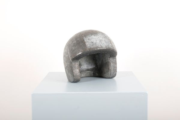 MARTIN SCOREY (1961-2021): A LEAD AND WOOD FOLK ART HELMET
