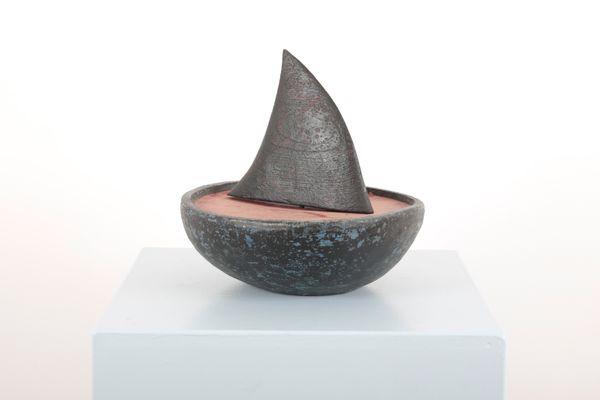MARTIN SCOREY (1961-2021): A FOLK ART POLYCHROME PAINTED WOODEN SHARK FIN IN A BOWL