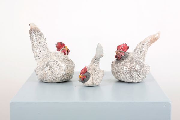 THREE ROOSTING RAKU CHICKENS
