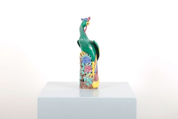 A CHINESE STYLE POLYCHROME PAINTED CERAMIC PHOENIX