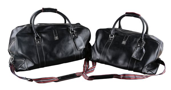 AN ASPINALL OF LONDON BLACK LEATHER FOUR PIECE LUGGAGE SET