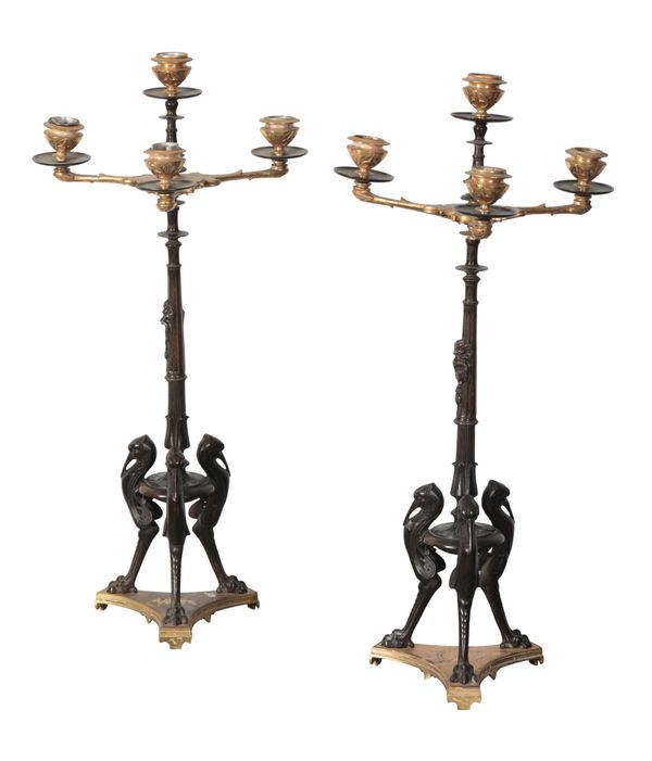 A PAIR OF REGENCY STYLE BRONZE AND GILT METAL CANDELABRA