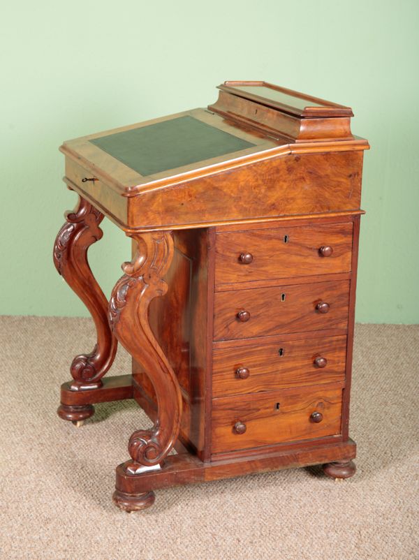 A VICTORIAN WALNUT DAVENPORT