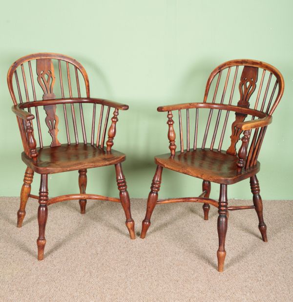 A PAIR OF YEW WOOD AND ELM HOOP BACK WINDSOR CHAIRS