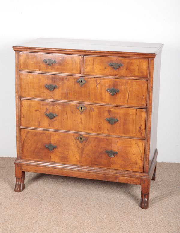 A GEORGE I WALNUT VENEERED CHEST OF DRAWERS