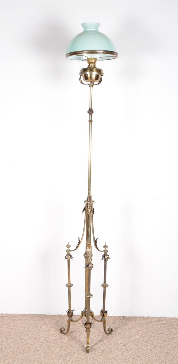 AN EDWARDIAN BRASS STANDARD LAMP