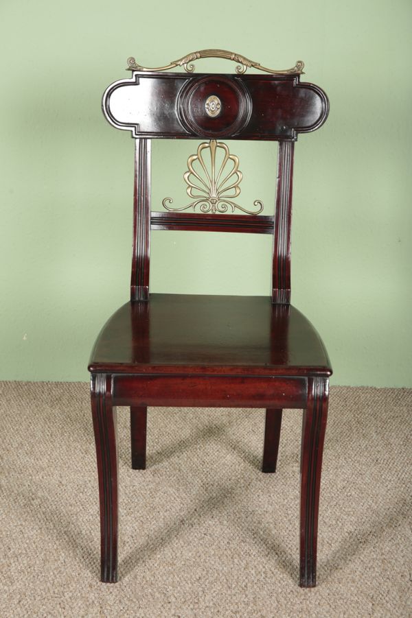 A REGENCY MAHOGANY AND BRASS INLAID HALL CHAIR IN THE STYLE OF GILLOWS