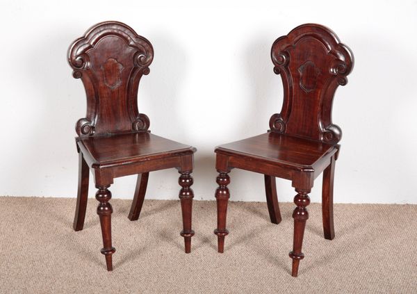 A PAIR OF VICTORIAN MAHOGANY HALL CHAIRS