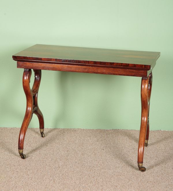 A REGENCY ROSEWOOD FOLD-OVER CARD TABLE IN THE MANNER OF GEORGE SMITH