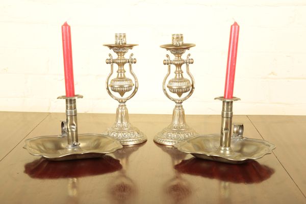 A PAIR OF BRASS CHAMBER CANDLESTICKS