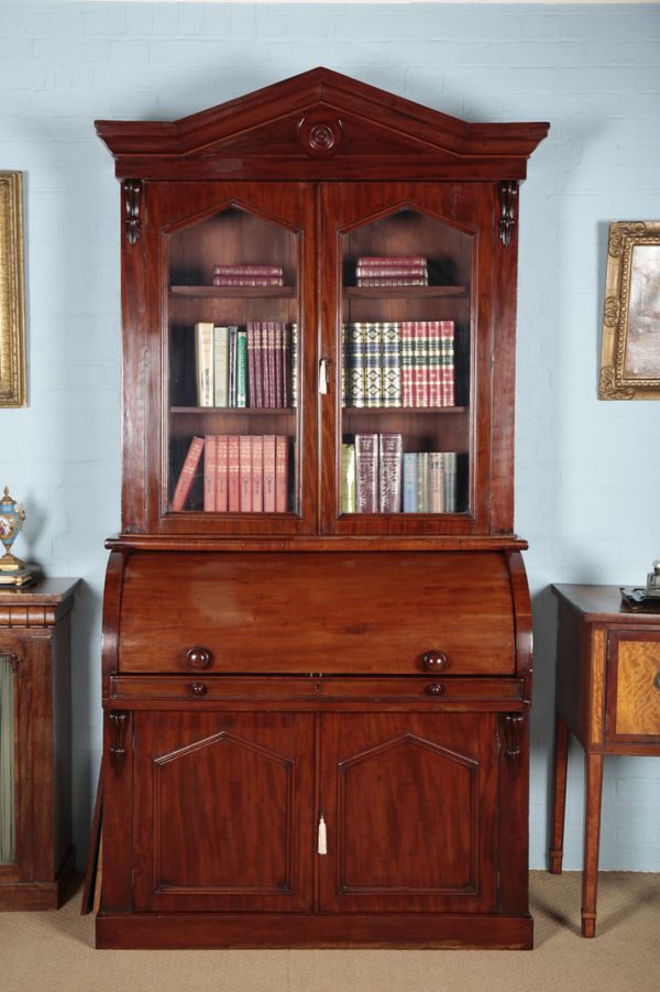 A VICTORIAN MAHOGANY CYLINDER BUREAU BOOKCASE