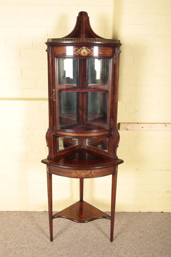 AN EDWARDIAN ROSEWOOD AND MARQUETRY CORNER CABINET