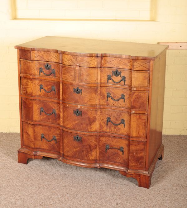 A CONTINENTAL WALNUT CHEST OF DRAWERS