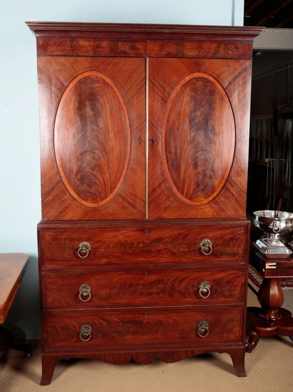 A GEORGE III MAHOGANY SECRETAIRE PRESS