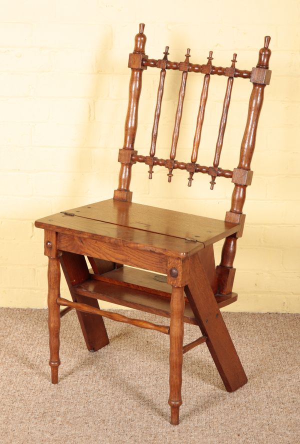 AN ARTS AND CRAFTS OAK METAMORPHIC CHAIR