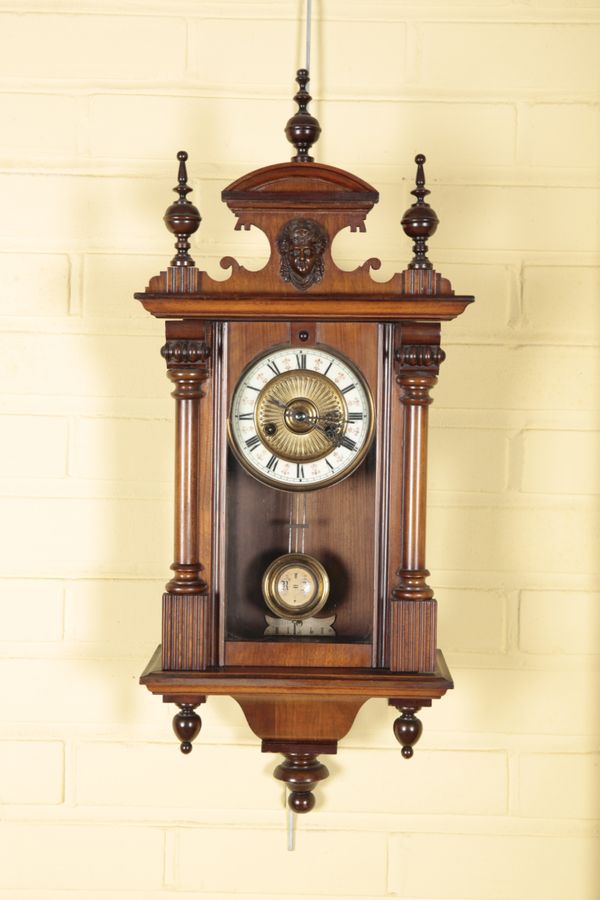 AN EDWARDIAN WALNUT 'VIENNA' WALL CLOCK