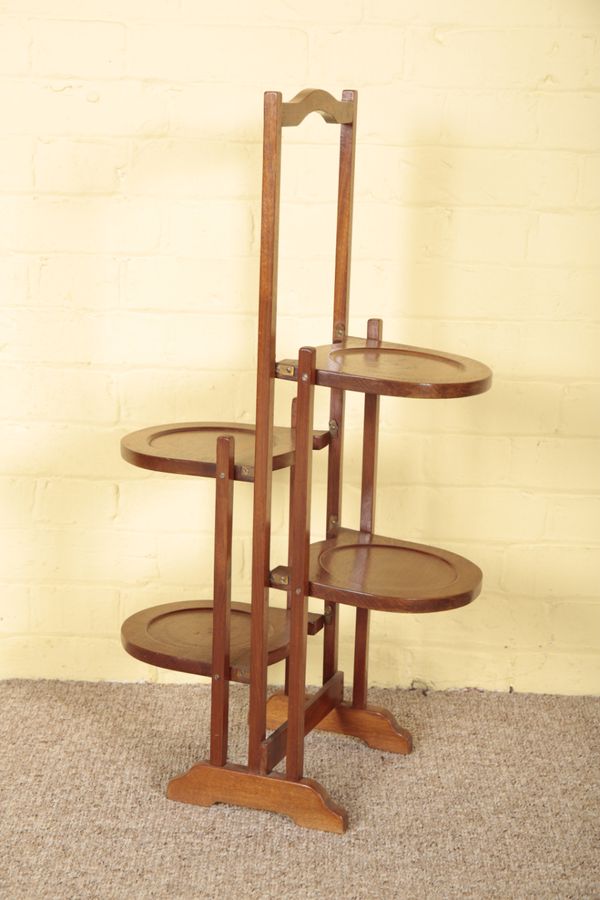 A MAHOGANY FOLDING DOUBLE CAKE STAND