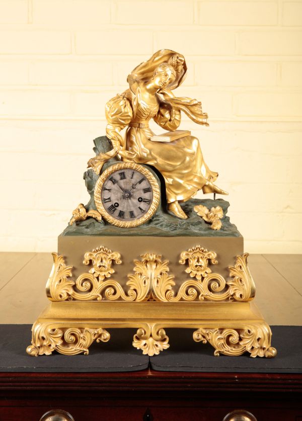 A FRENCH GILT METAL MANTEL CLOCK