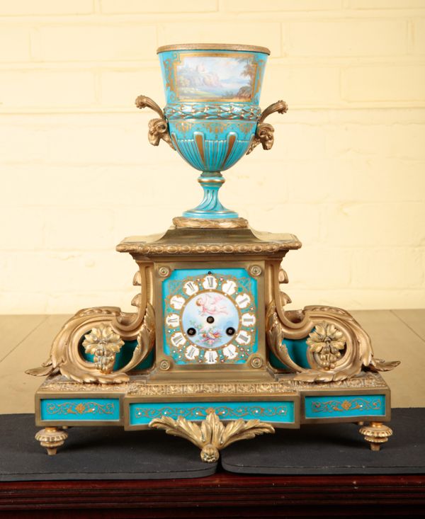 A FRENCH GILT METAL AND PORCELAIN MOUNTED MANTEL CLOCK