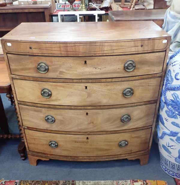 A REGENCY FIGURED MAHOGANY BOWFRONT CHEST OF DRAWERS