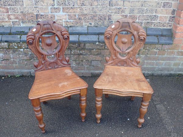 A PAIR OF VICTORIAN MAHOGANY HALL CHAIRS