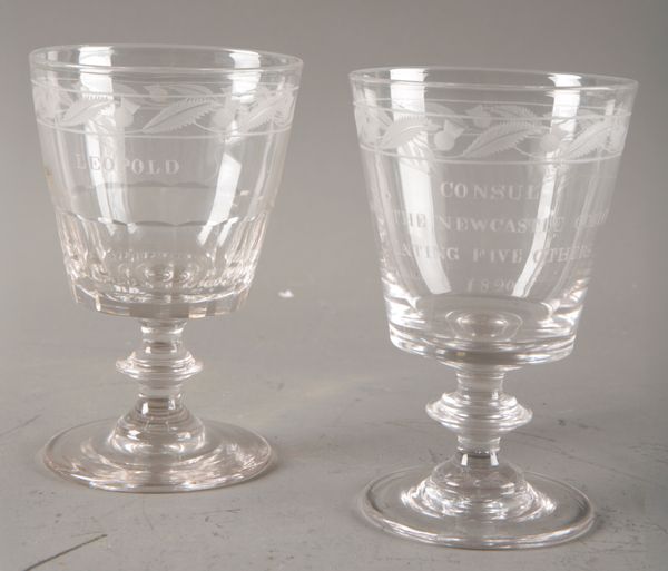 A PAIR OF MATCHED ENGRAVED RACING GLASSES OR GOBLETS