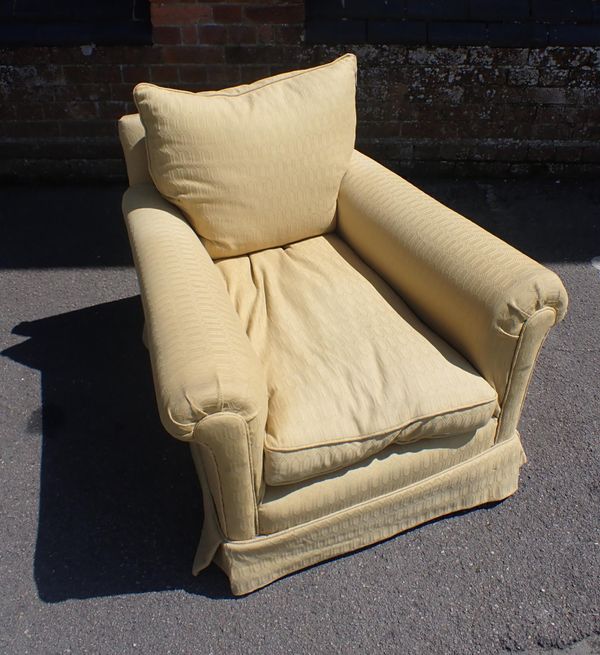 A COUNTRY HOUSE STYLE DEEP UPHOLSTERED ARMCHAIR