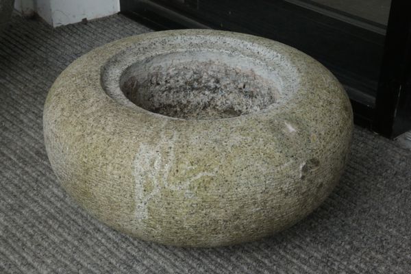 A GRANITE OR HARDSTONE CIRCULAR PLANTER