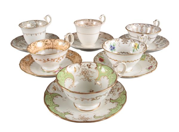 A GROUP OF SIX H & R DANIEL SUTHERLAND SHAPE CUPS AND SAUCERS