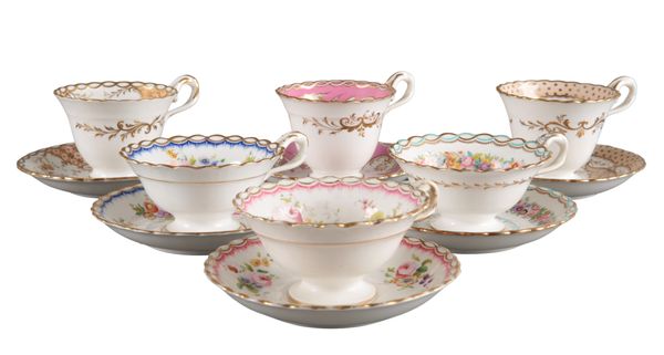 A GROUP OF SIX H & R DANIEL CHAIN EDGE SHAPE CUPS AND SAUCERS