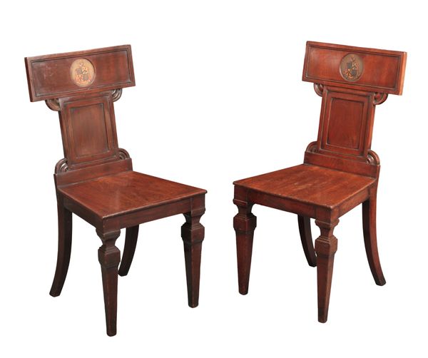 A PAIR OF GEORGE IV MAHOGANY ARMORIAL HALL CHAIRS