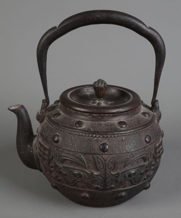 A JAPANESE BRONZE TETSUBIN OR KETTLE