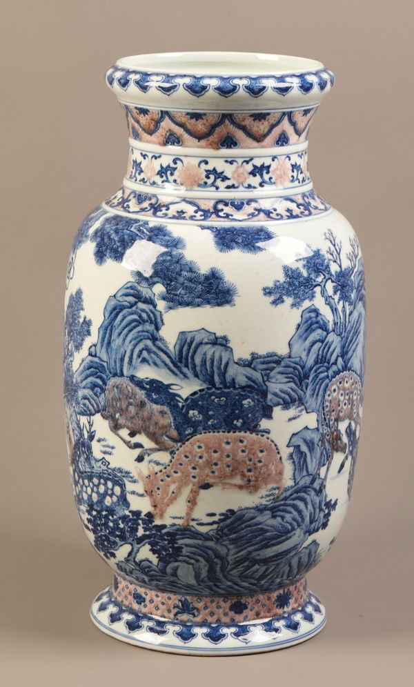 A LARGE AND RARE CHINESE PORCELAIN BLUE, WHITE AND UNDERGLAZE RED 'DEER' LANTERN VASE