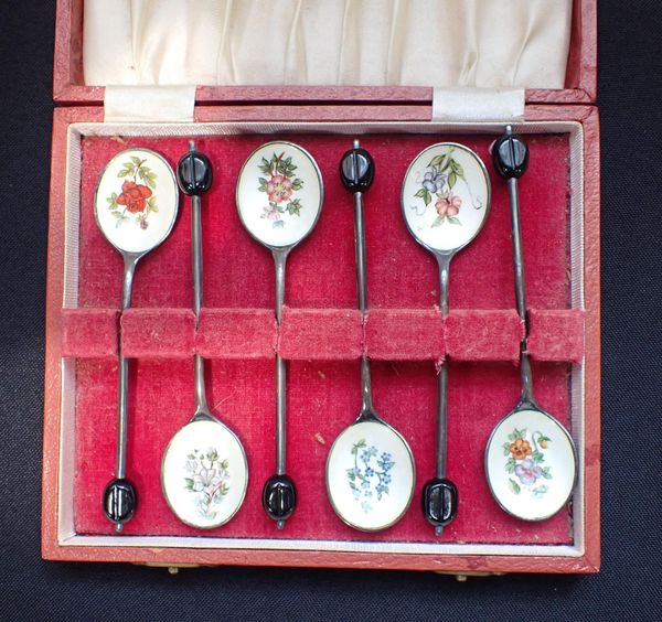 A CASED SET OF SILVER AND FLORAL ENAMEL SPOONS