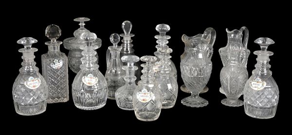 A PAIR OF REGENCY CUT GLASS BOTTLE SHAPED DECANTERS