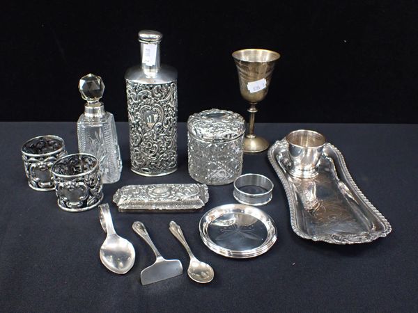 A LATE VICTORIAN SILVER COVERED GLASS BOTTLE