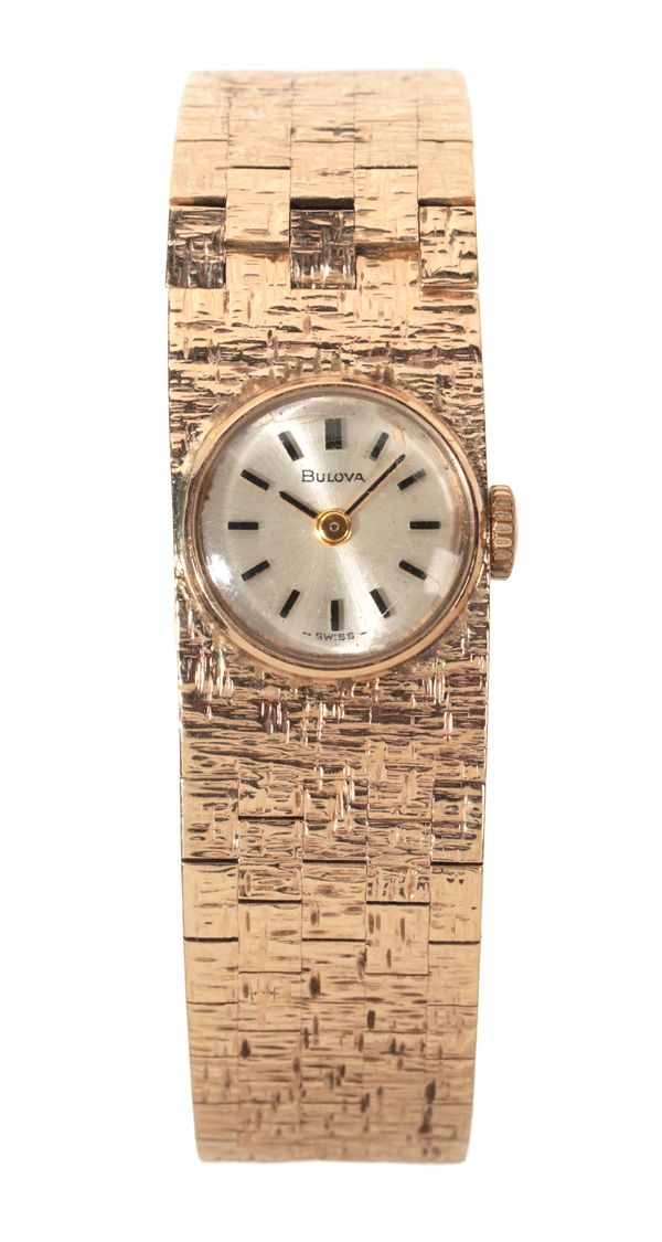 BULOVA: A LADY'S 9CT GOLD BRACELET WATCH