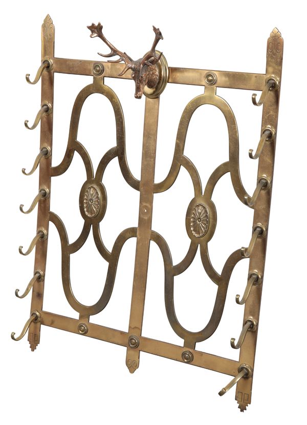 AN EDWARDIAN SCOTTISH HUNTING LODGE BRASS WALL MOUNTED STICK RACK